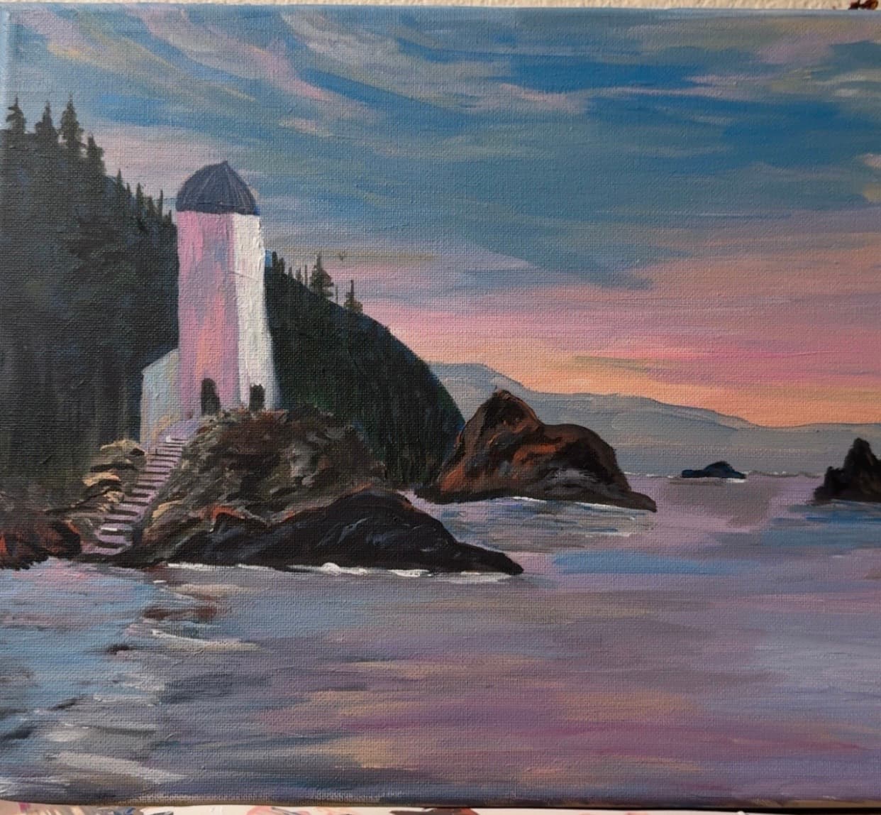 A sunset at a lighthouse in a coastal town